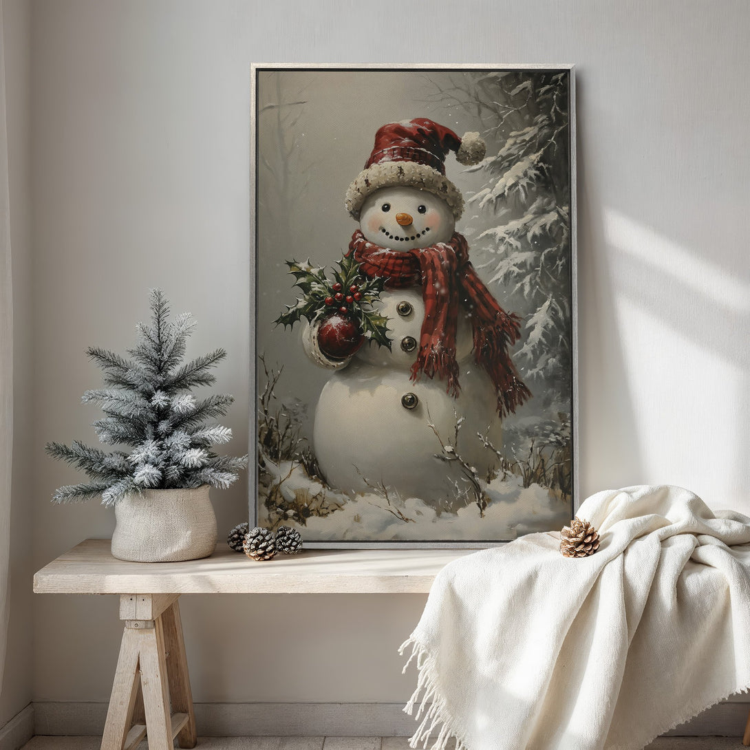Framed Wall Art: Festive snowman art print with a vintage style. Features a red and white color palette, perfect for holiday decor. Add a touch of winter charm!