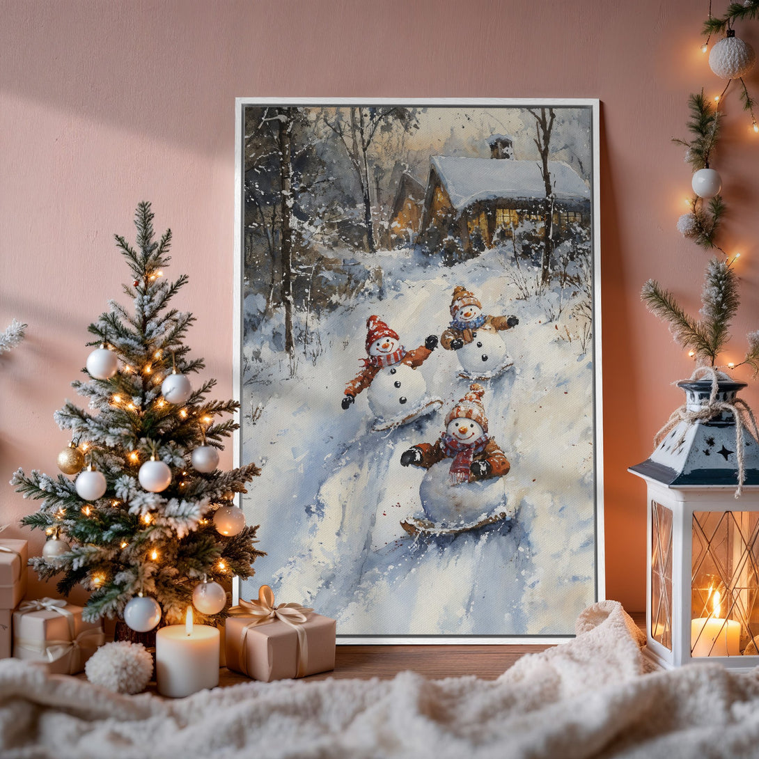 Framed Wall Art: Watercolor painting of snowmen sledding down a snowy hill in a winter scene. Soft blues, whites, and browns. Perfect holiday decor.