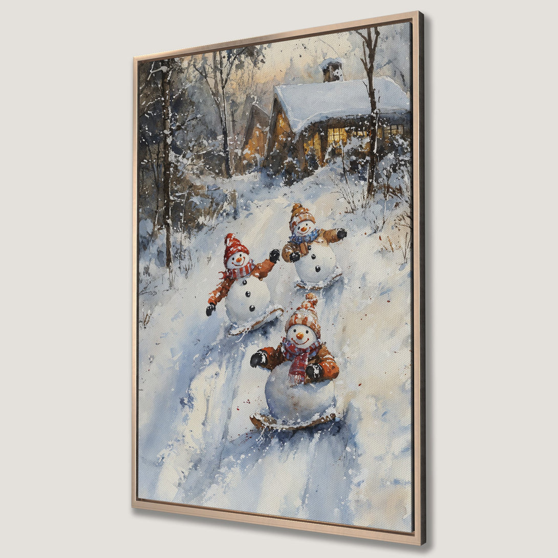 Framed Wall Art featuring a watercolor painting of snowmen sledding in a winter wonderland. Charming, whimsical art with a cool blue and warm orange palette.