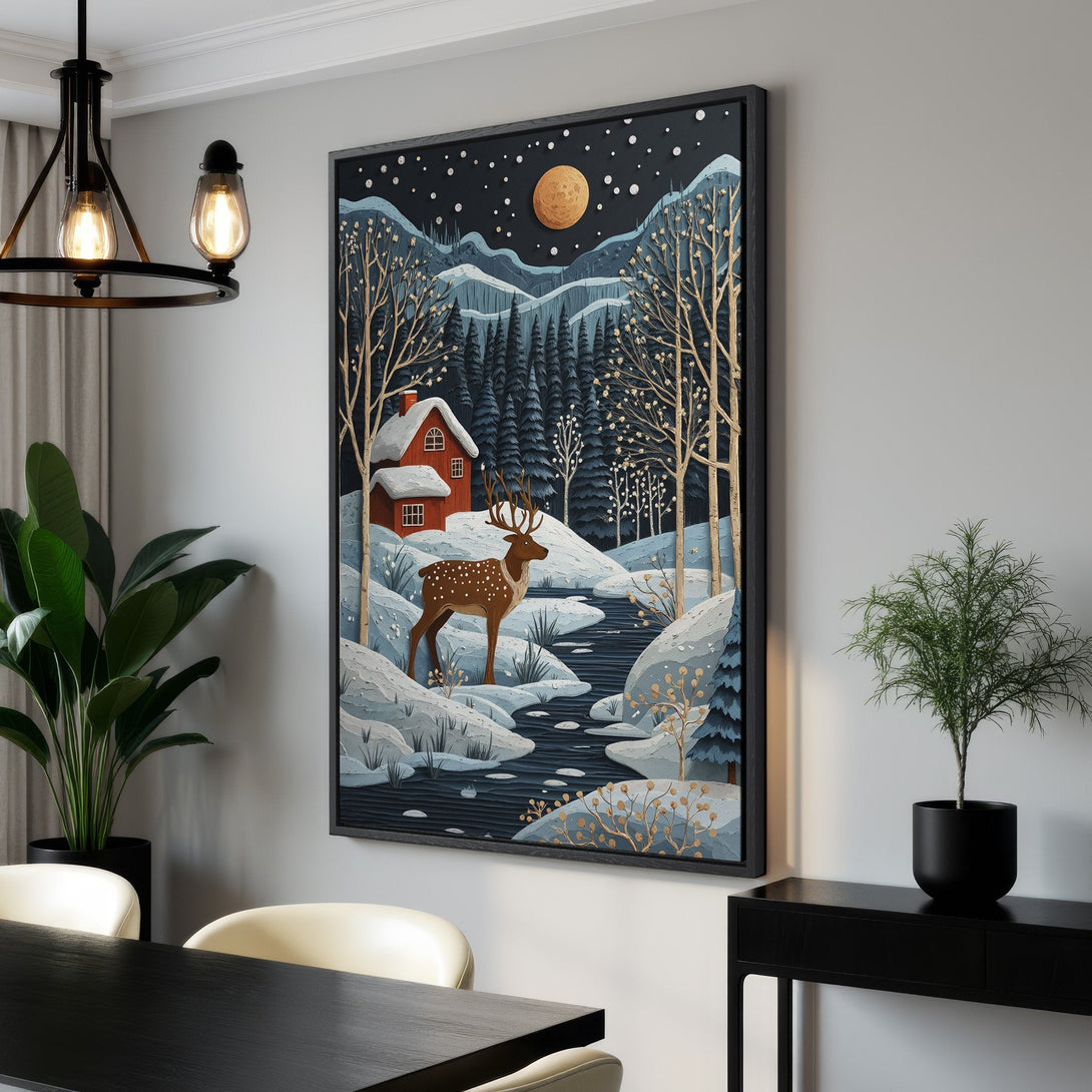 Framed Wall Art: Winter landscape Canvas Print with deer, cabin, and moon. Features a cool blue, gold, and red color palette, perfect for cozy home decor.