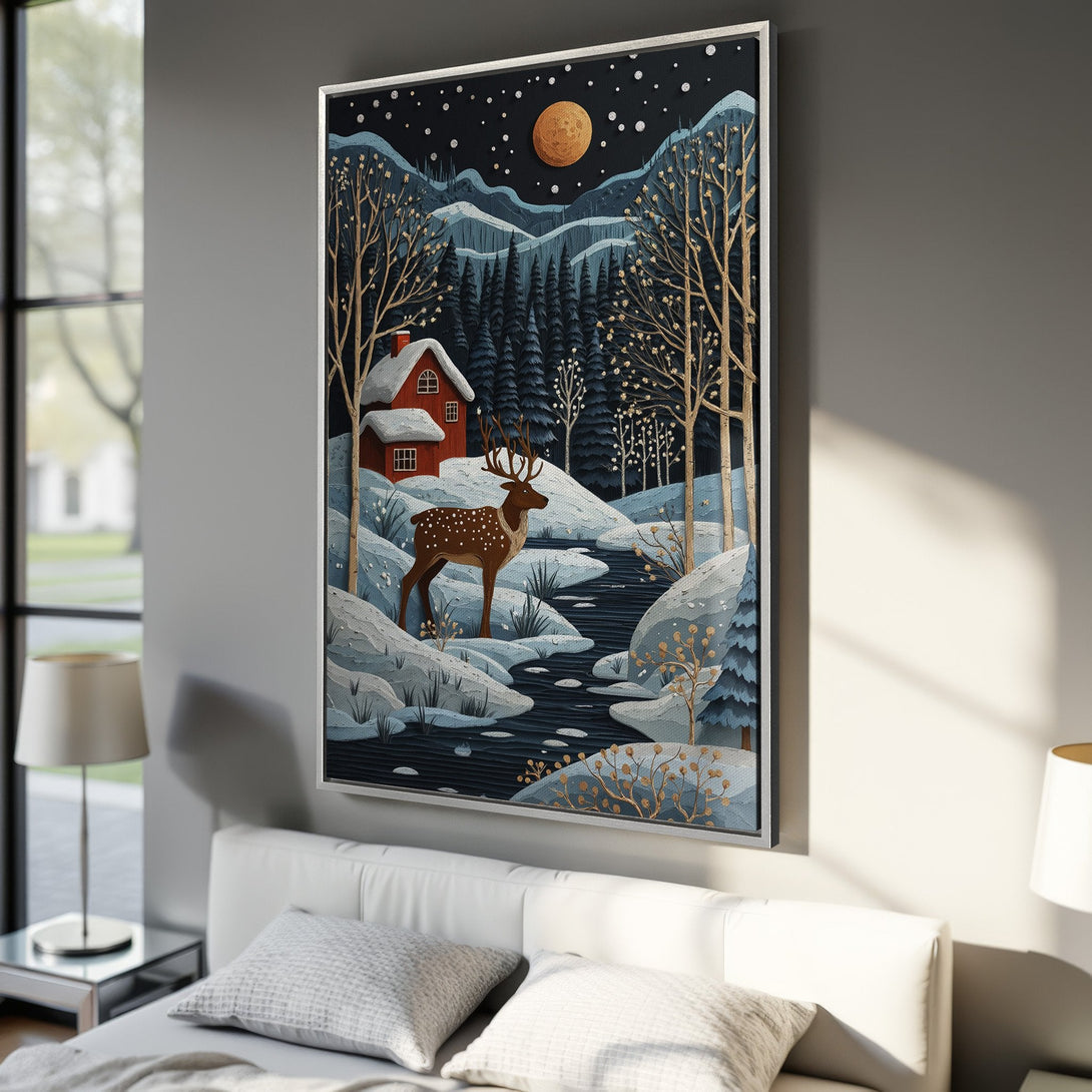 Framed Wall Art: Winter landscape Canvas Print with a deer, red cabin, and trees. Features a blue, brown, and gold color palette, perfect for cozy decor.