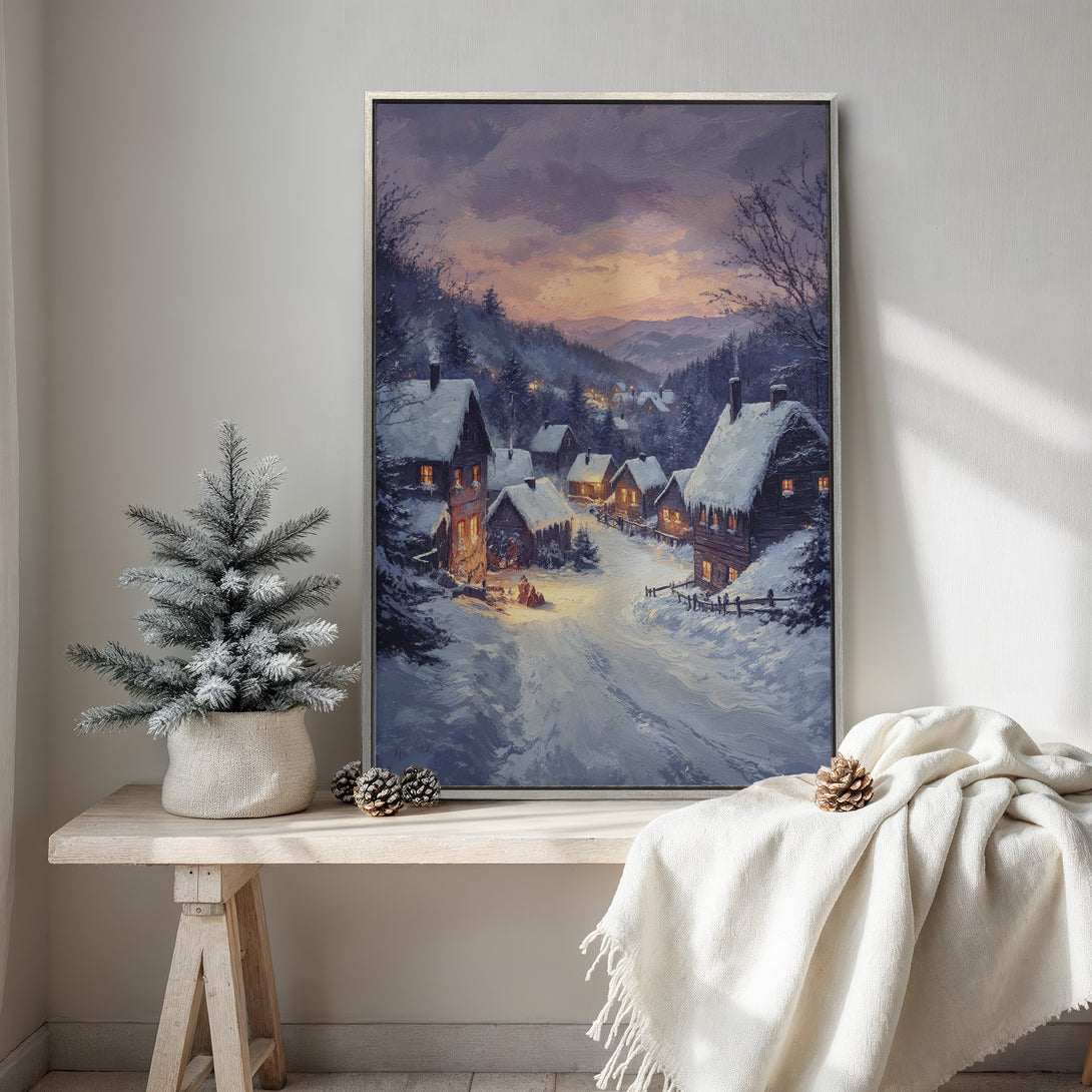 Framed Wall Art featuring a winter village scene in a painterly style. Warm, inviting colors of purple, orange, and blue create a cozy, seasonal feel.