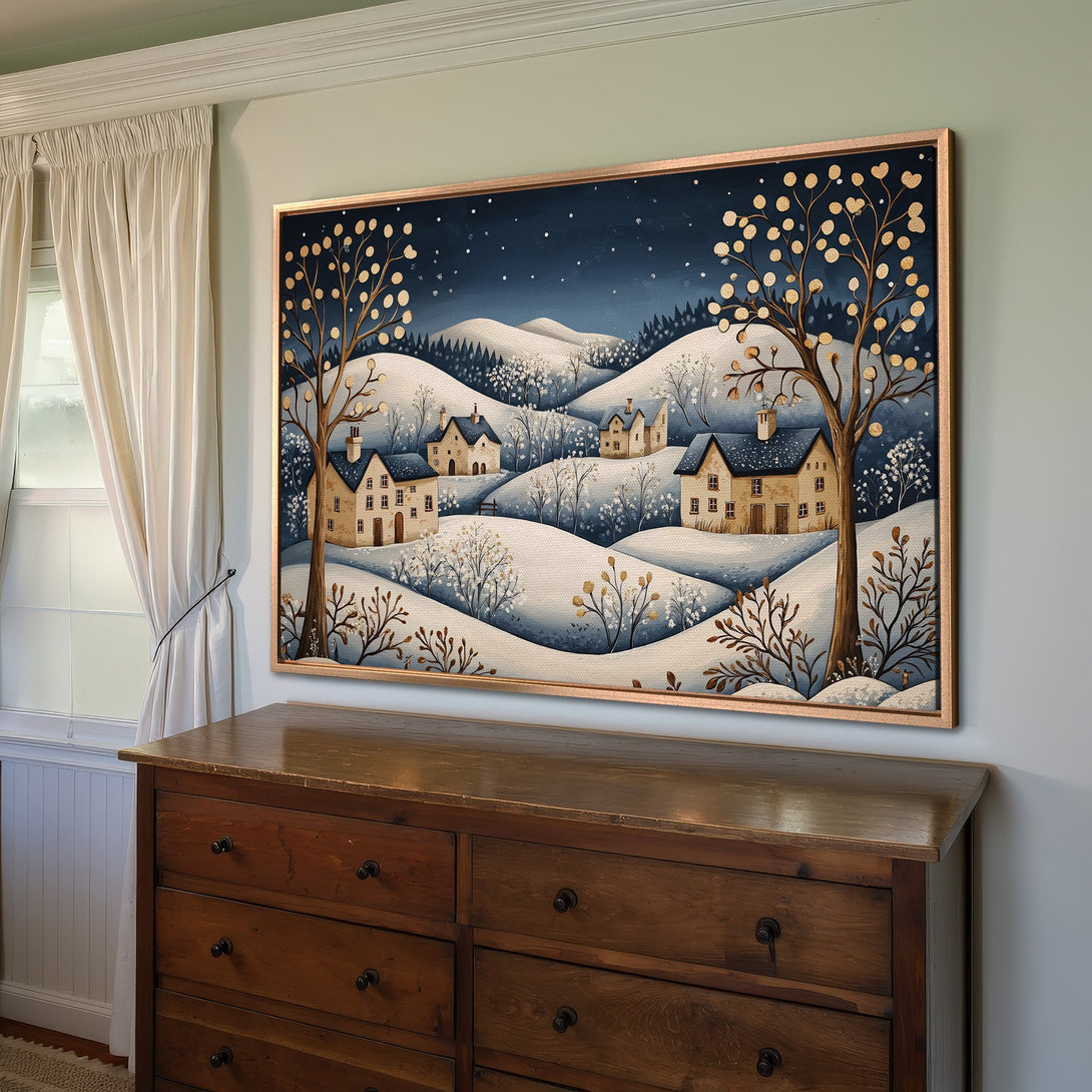 Framed Wall Art: Winter landscape Canvas Print in blue and gold. Cozy cottage scene, perfect for adding warmth to your home decor.