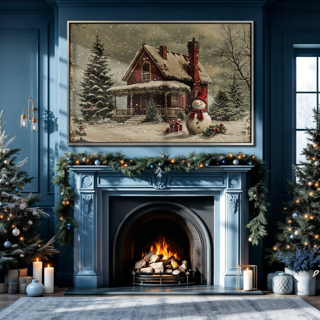 Framed Wall Art: Cozy Christmas scene in a blue-toned living room. Features a snowy house, snowman, and warm fireplace. Perfect holiday decor!