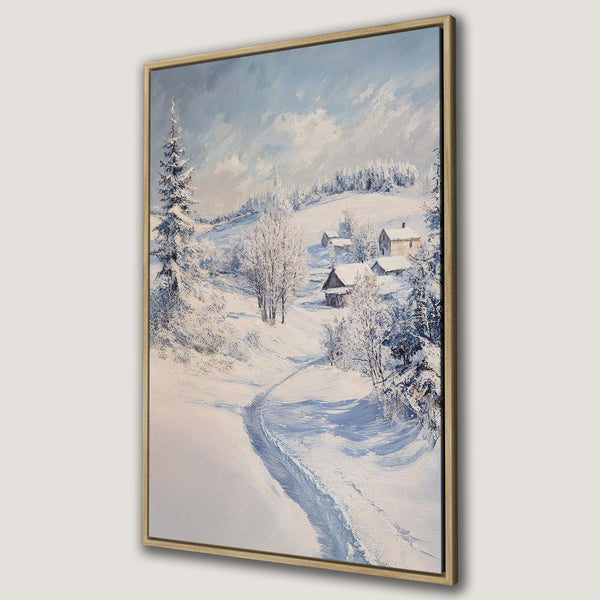 Framed Wall Art of a winter landscape with snow-covered houses and trees. Oil painting style with a serene blue and white color palette. Perfect for cozy decor.