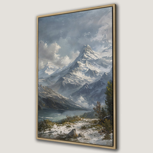 Framed Wall Art: Stunning mountain landscape canvas print in a classic style. Features a serene lake and snowy peaks, with a cool, muted color palette.