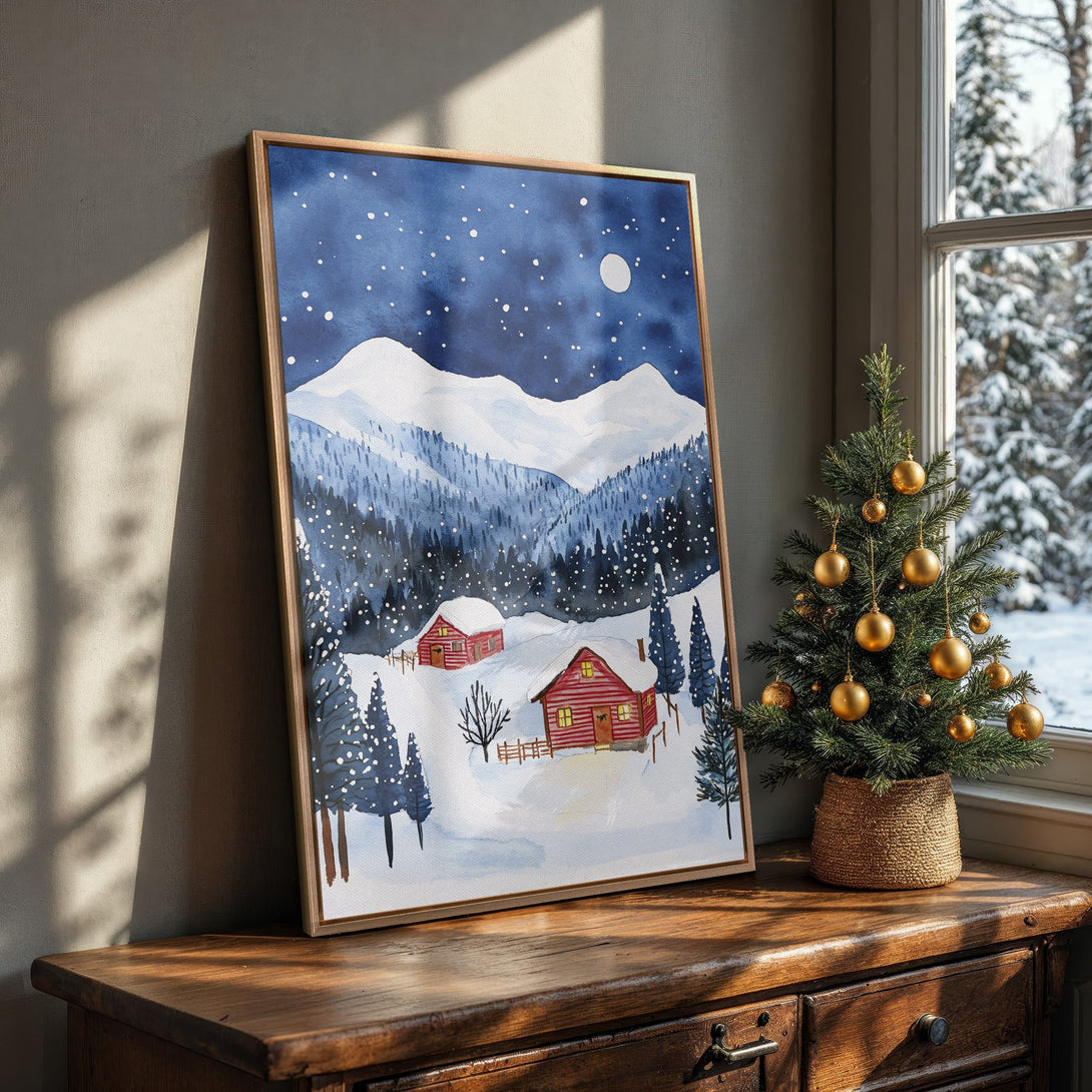 Framed Wall Art: Watercolor winter landscape Canvas Print with snowy mountains, cabin, and blue/white/red color palette. Cozy & inviting home decor.