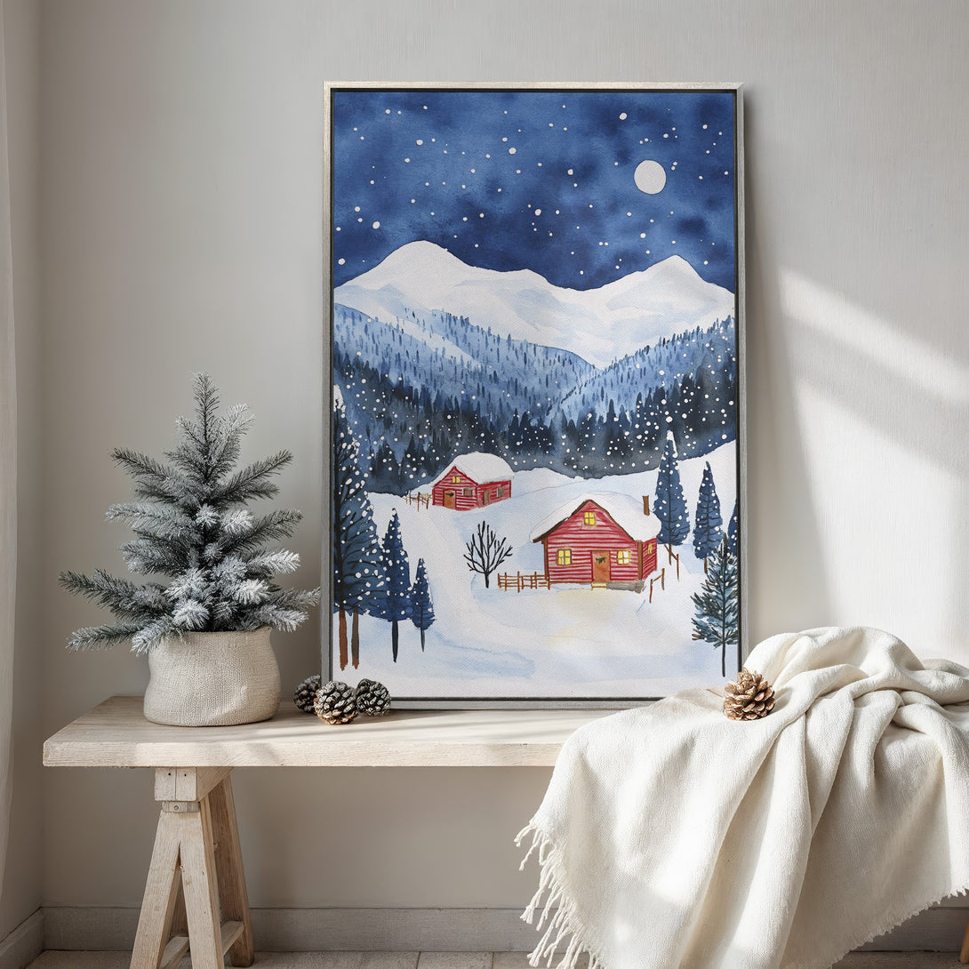 Framed Wall Art: Watercolor winter landscape with red cabins, snowy mountains, and a blue & white color palette. Perfect for cozy decor!