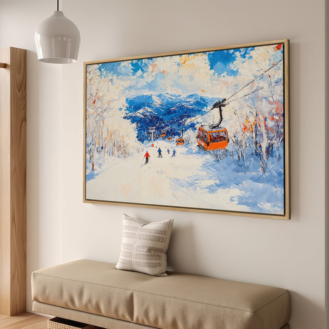 Framed Wall Art: Winter ski scene canvas print in blue, orange, and white. Perfect for adding a touch of mountain charm to your home decor.