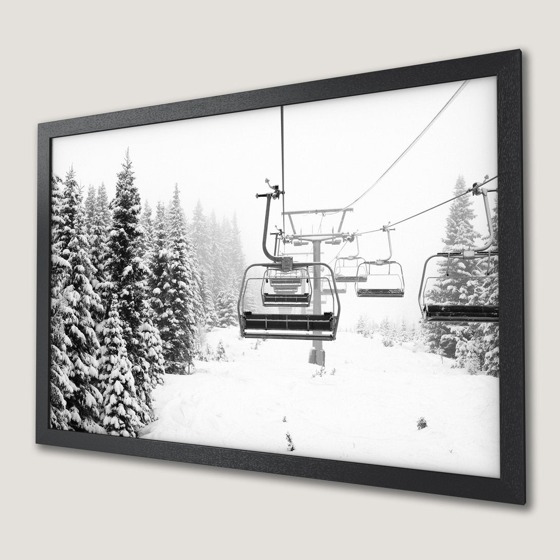 Framed Poster of a snowy ski lift scene in black and white. Capture the winter wonderland with this stunning wall art.