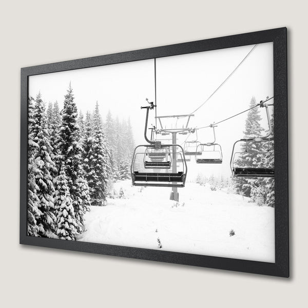 Framed Poster of a snowy ski lift scene in black and white. Capture the winter wonderland with this stunning wall art.