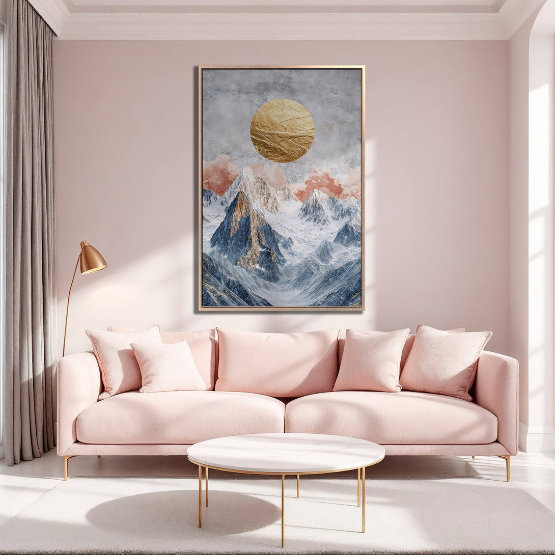 Framed Wall Art featuring a mountain landscape with a gold sun, in a modern interior with a blush pink color palette.