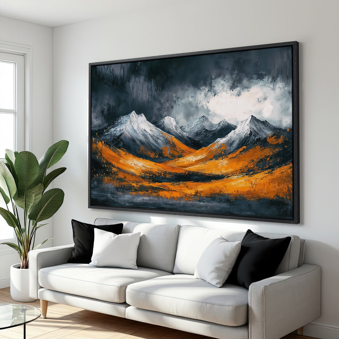 Framed Wall Art: Abstract mountain landscape canvas print in a modern interior. Features a bold orange, gray, and white color palette. Elevate your space!
