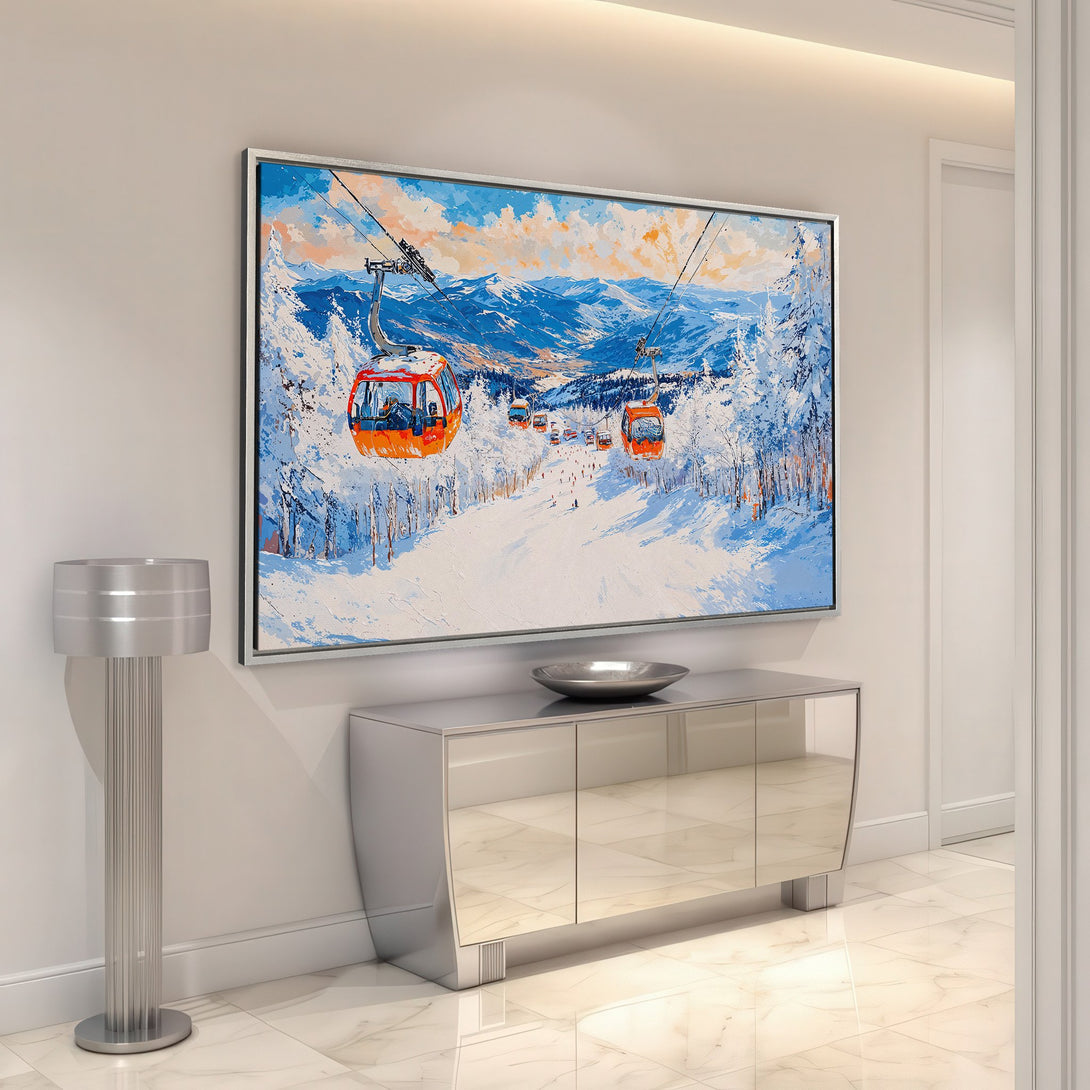 Framed Wall Art: Ski lift canvas print in a modern interior. Featuring a winter landscape with blue, white, and orange hues. Perfect for adding a touch of art to your home.