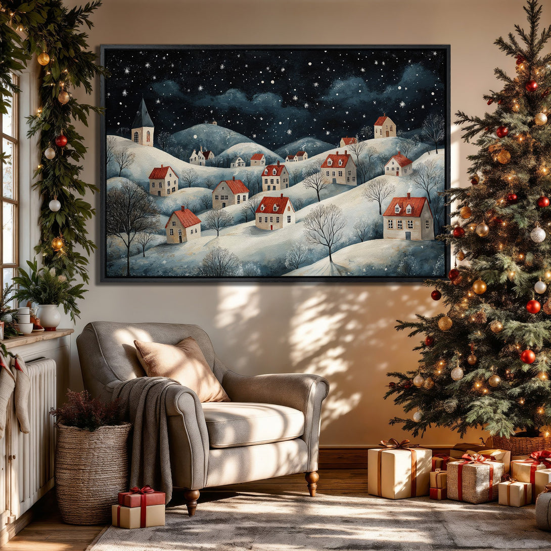 Framed Wall Art: Winter village scene Canvas Print with red-roofed houses under a starry night sky. Cozy, painterly style with blue, white, and red tones. Perfect for holiday decor.