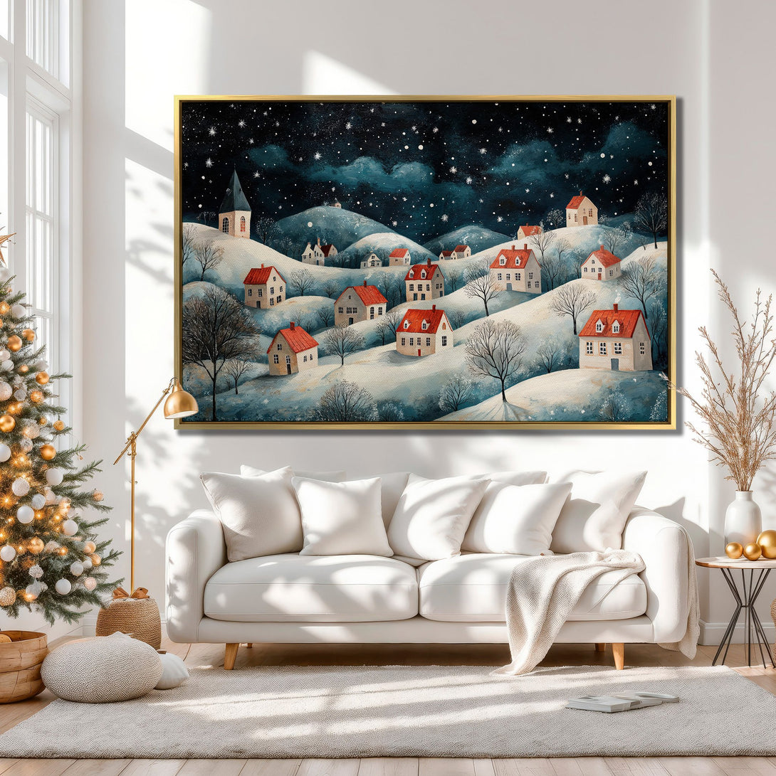 Canvas Print of a winter village scene in a whimsical style. Features a snowy landscape with red-roofed houses, dark blue night sky, and a neutral color palette.