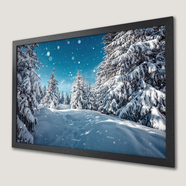 Framed Poster of a snowy winter forest scene. Serene landscape with white, blue, and black color palette. Perfect wall art for a cozy home.