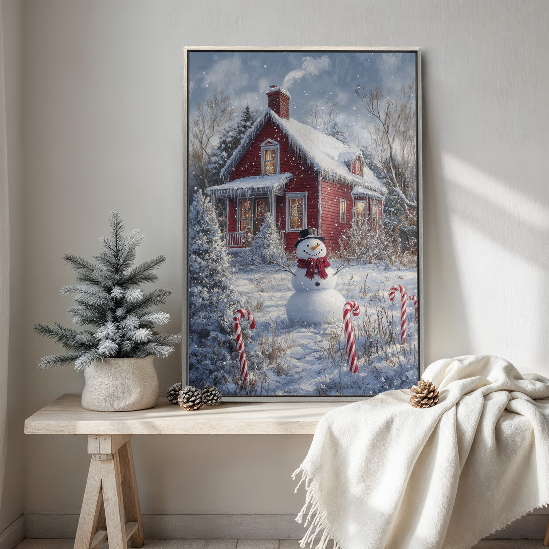 Framed Wall Art: Winter scene Canvas Print featuring a red house, snowman, and snowy landscape. Warm, inviting color palette perfect for holiday decor.