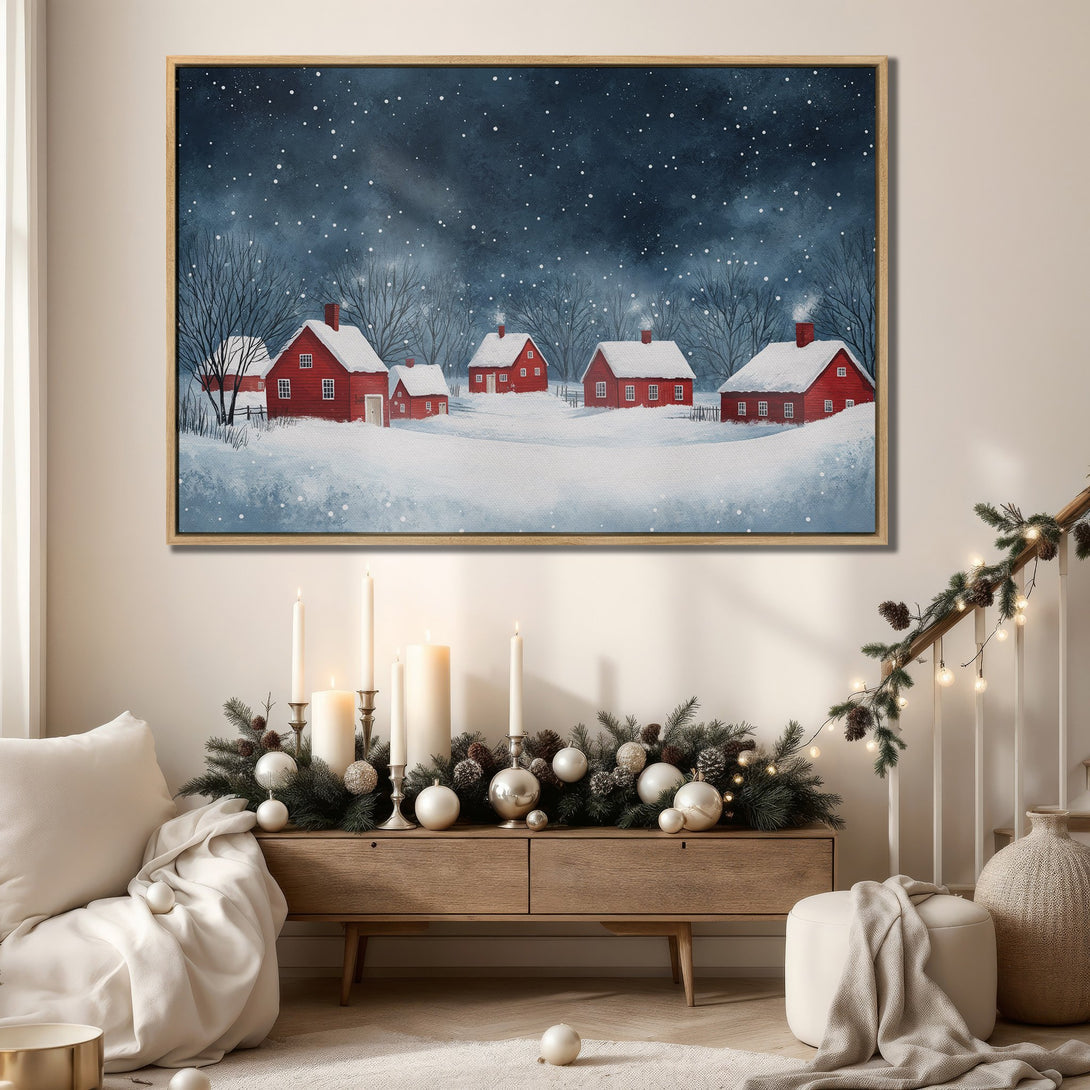 Framed Wall Art featuring a winter village scene with red houses, in a watercolor style. The artwork has a blue and red color palette, perfect for cozy decor.