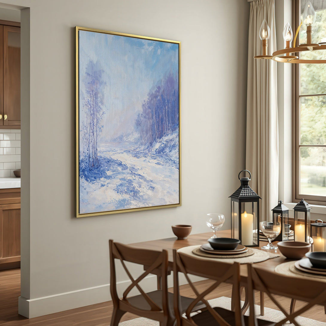 Canvas Print of a winter landscape painting in blue and white tones, displayed in a cozy interior setting.