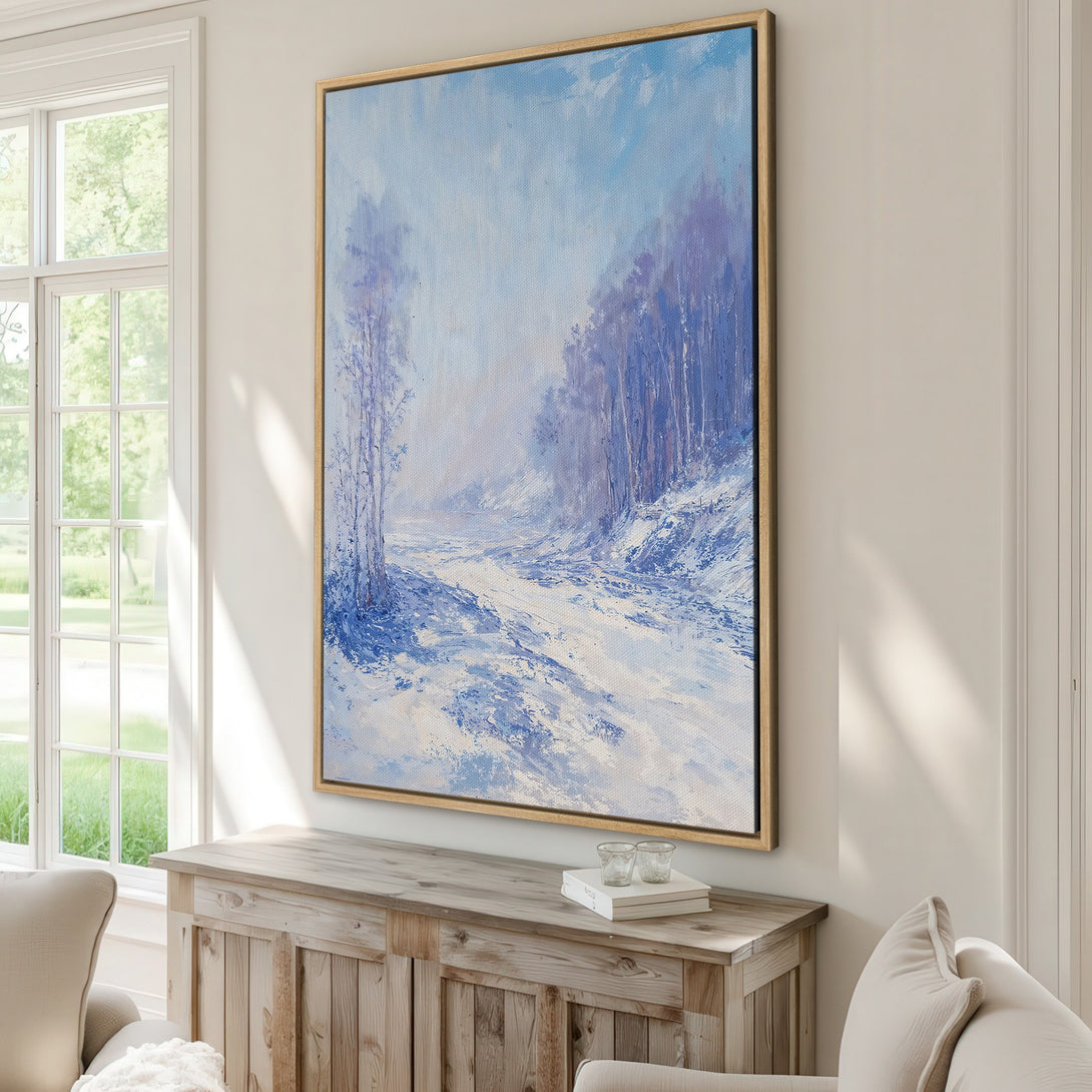 Framed Wall Art featuring a winter landscape painting in cool blue and white tones, perfect for adding a touch of serenity to your home decor.