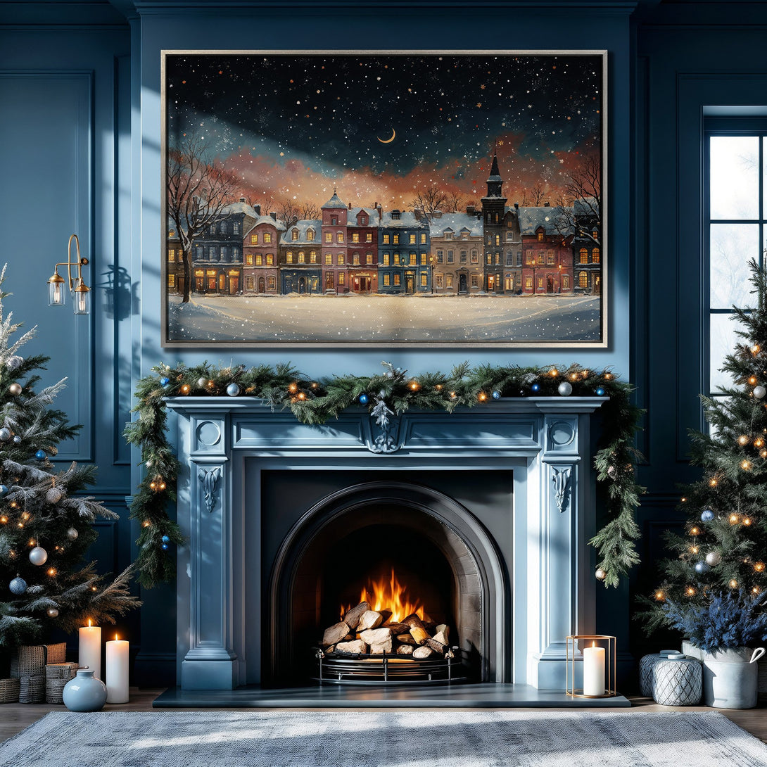Framed Wall Art of a snowy village scene, warm colors against a cool blue interior. Perfect for Christmas decor!