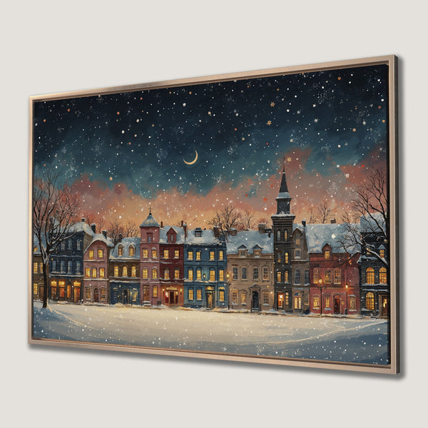 Framed Wall Art: Winter cityscape Canvas Print. Warm, inviting colors with snow-covered buildings under a starry night sky. Perfect for cozy decor.