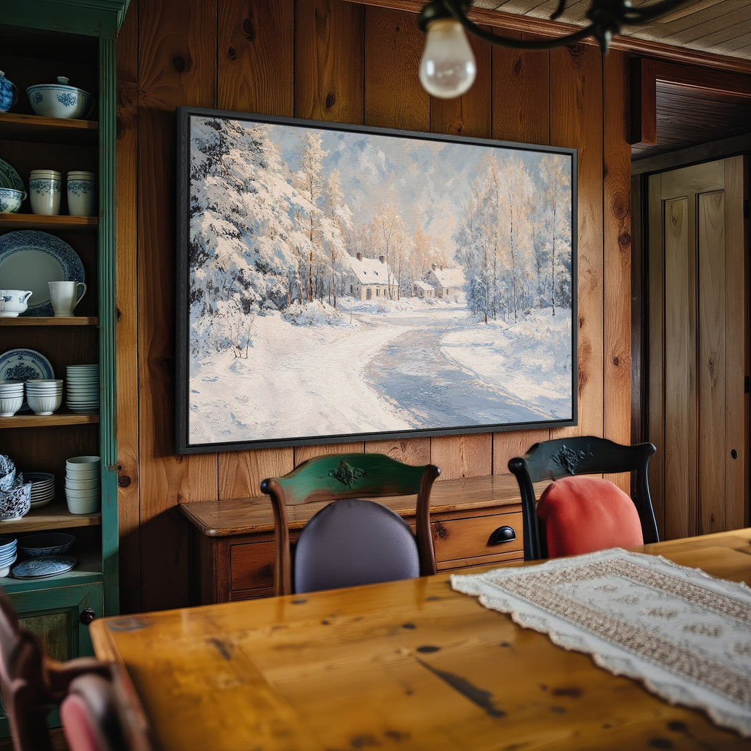 Framed Wall Art: Winter landscape Canvas Print with a snowy road and houses. Features a cool blue and white color palette, perfect for cozy interiors.