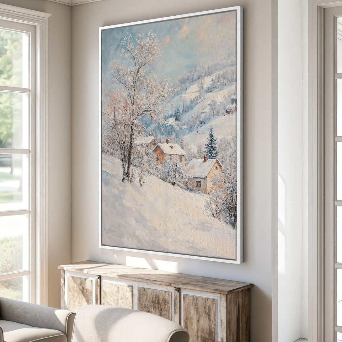 Framed Wall Art of a winter landscape with snow-covered houses. Impressionistic style with a soft, cool color palette of blues, whites, and warm yellows.