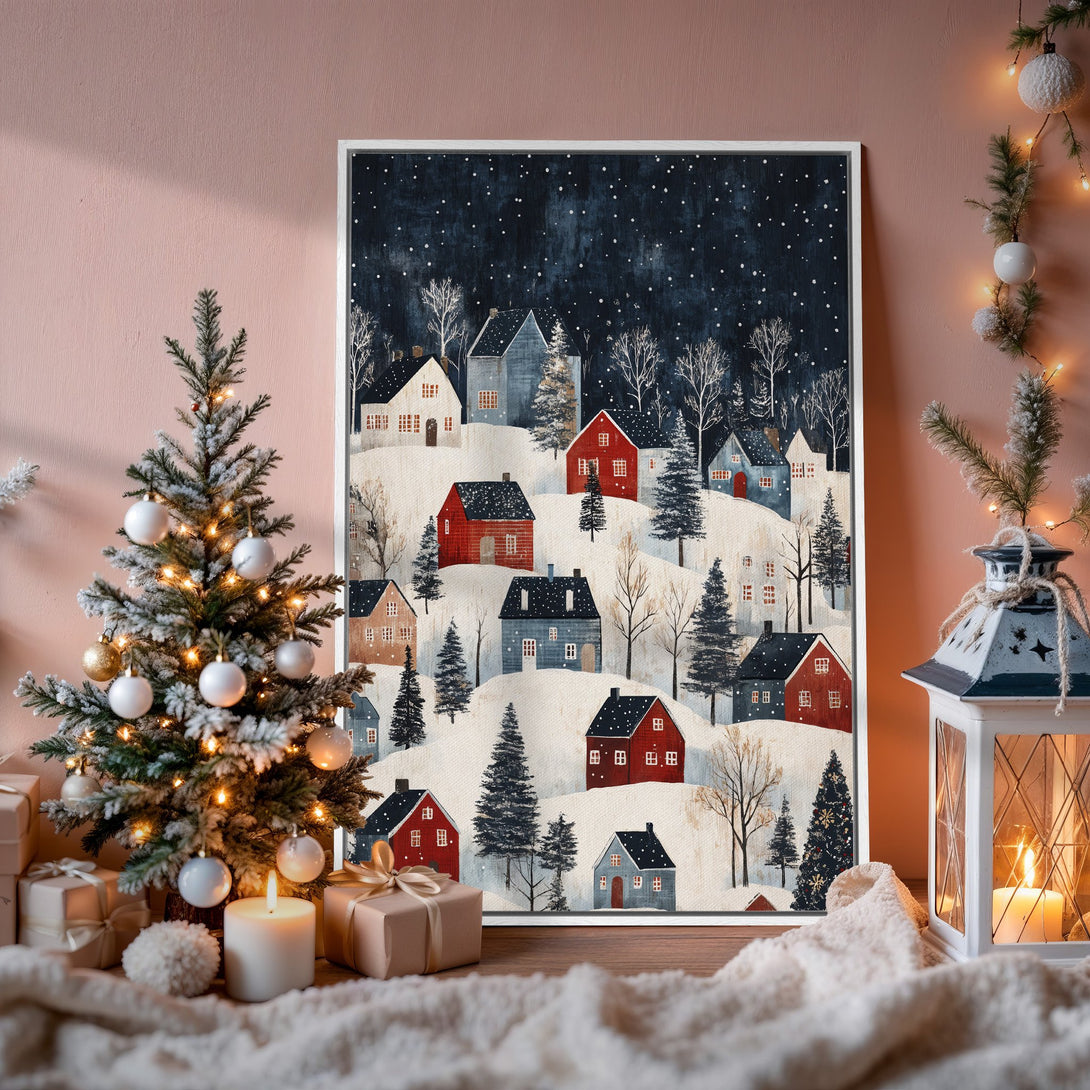 Framed Wall Art: Winter village scene with red and blue houses on a snowy landscape. Rustic style, dark blue and red color palette. Perfect holiday decor.