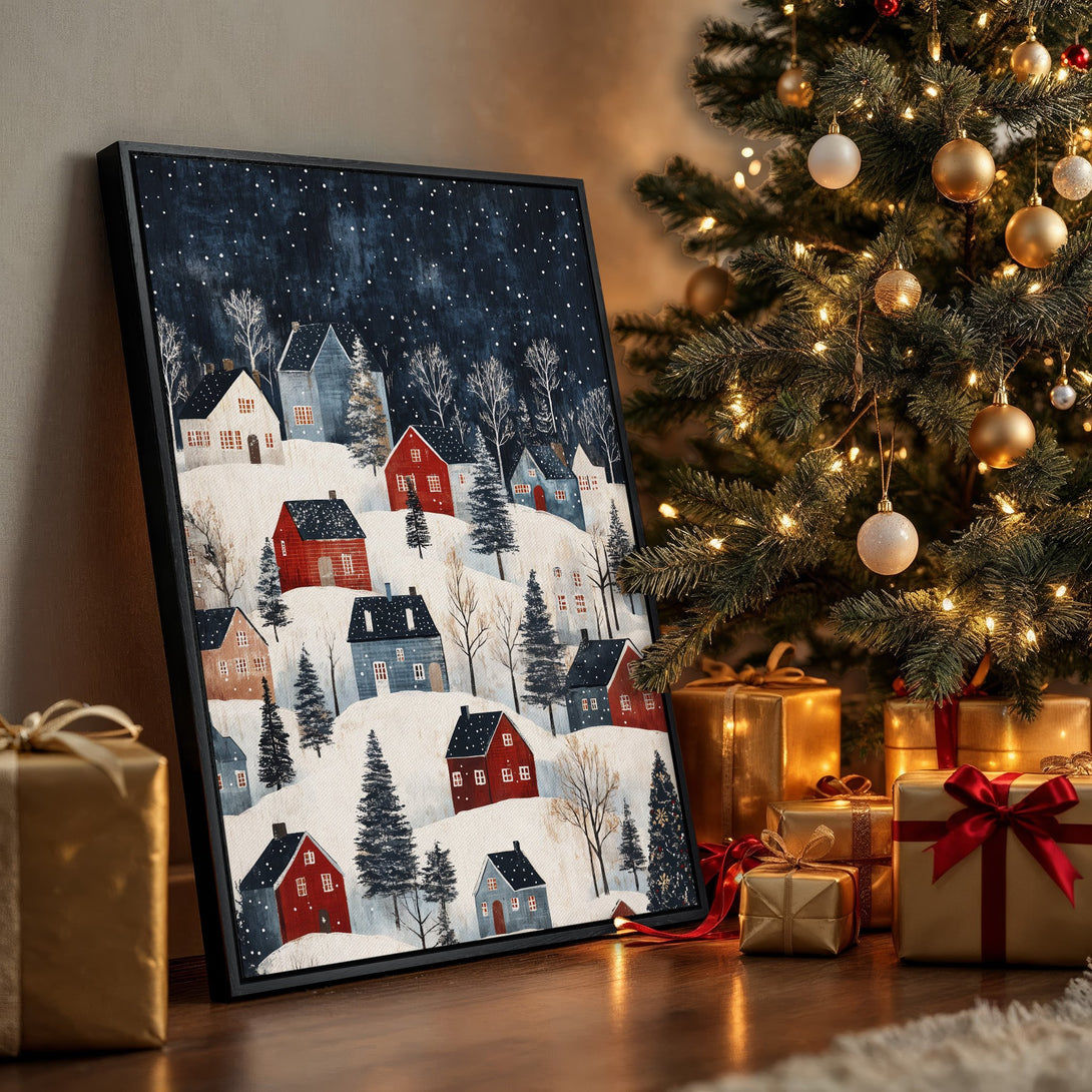 Framed Wall Art featuring a winter village scene in a cozy, illustrative style. Blue, red, and white color palette. Perfect holiday decor!