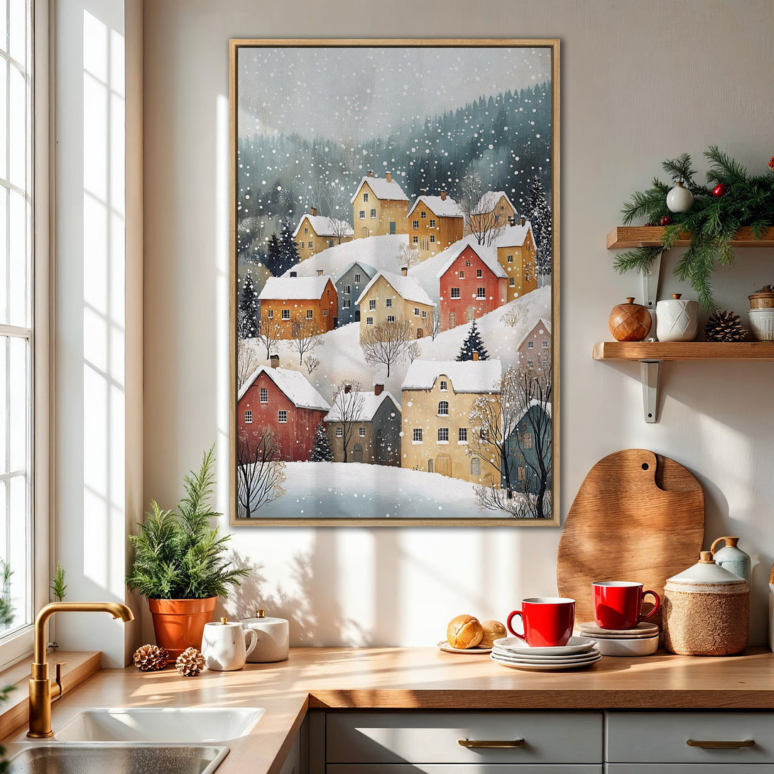Framed Wall Art featuring a winter village scene in watercolor style. Warm, inviting color palette with reds, yellows, and blues. Cozy home decor.