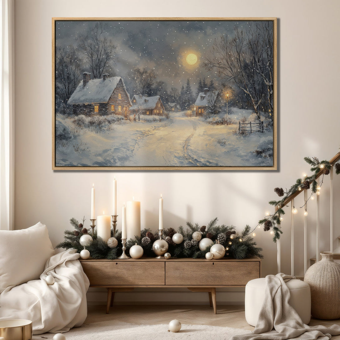 Framed Wall Art: Cozy winter scene Canvas Print with snow-covered cabins, a warm color palette, and a touch of holiday charm for your home decor.