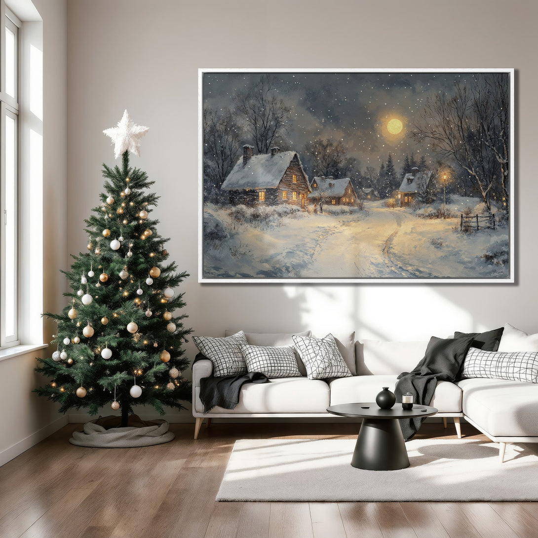 Framed Wall Art: Winter landscape Canvas Print in a cozy living room. Features a snowy village scene with a cool, neutral color palette, perfect for holiday decor.
