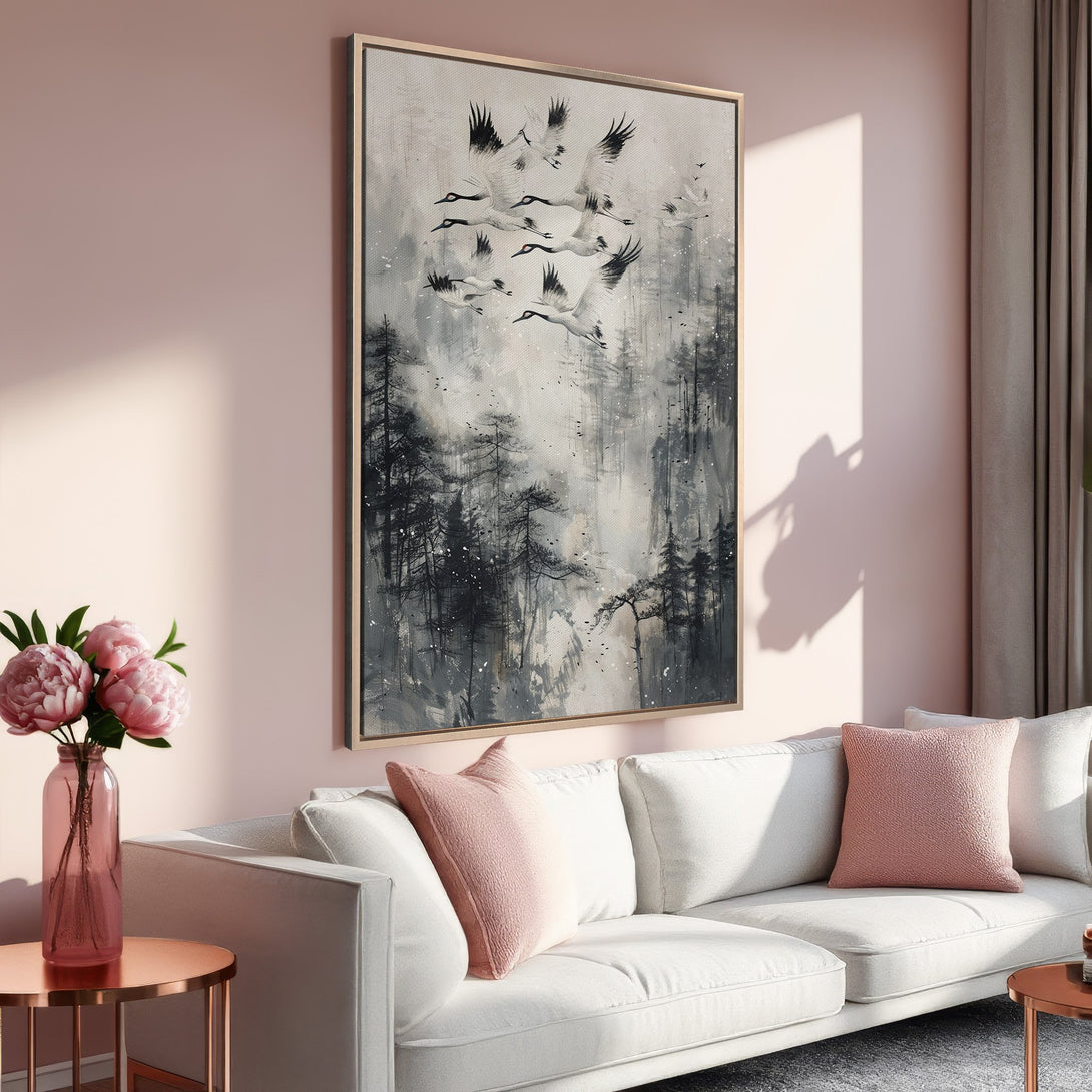 Framed Wall Art featuring cranes in flight over a misty forest. Modern, minimalist style with a neutral gray and black palette. Perfect for any living room!