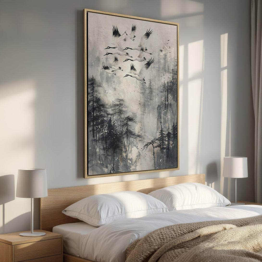 Framed Wall Art featuring flying cranes over a misty forest. Neutral gray and black palette. Modern, serene art for bedroom decor.