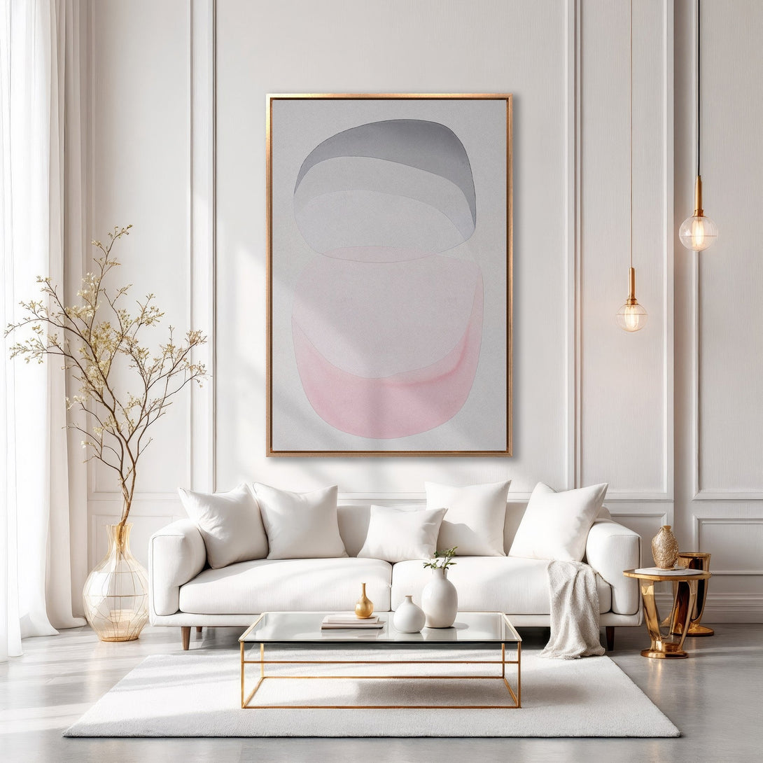 Framed Wall Art in a modern living room. Abstract art in pink, gray, and white tones. Elevate your space with this stylish Canvas Print.