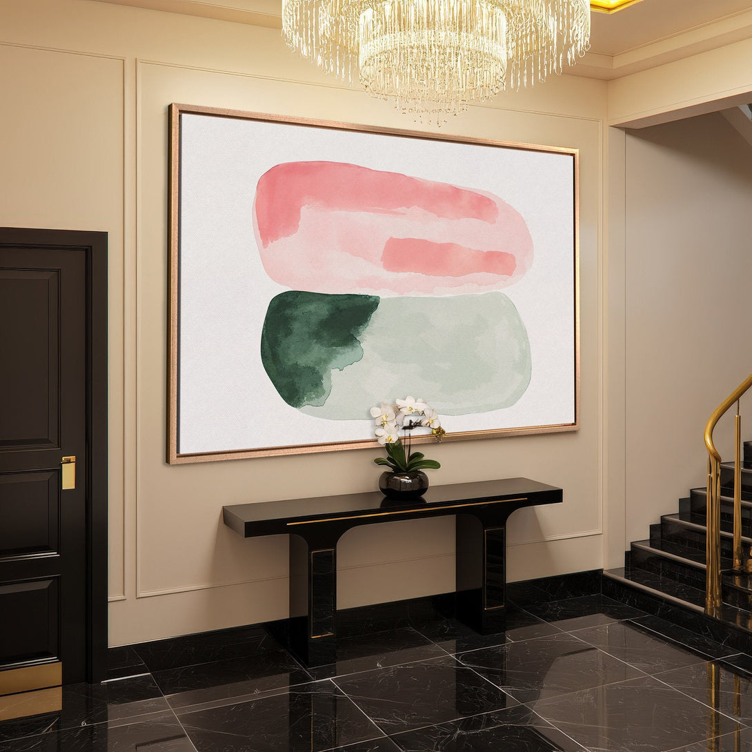 Framed Wall Art featuring abstract watercolor shapes in pink and green, displayed in a modern interior with neutral tones.