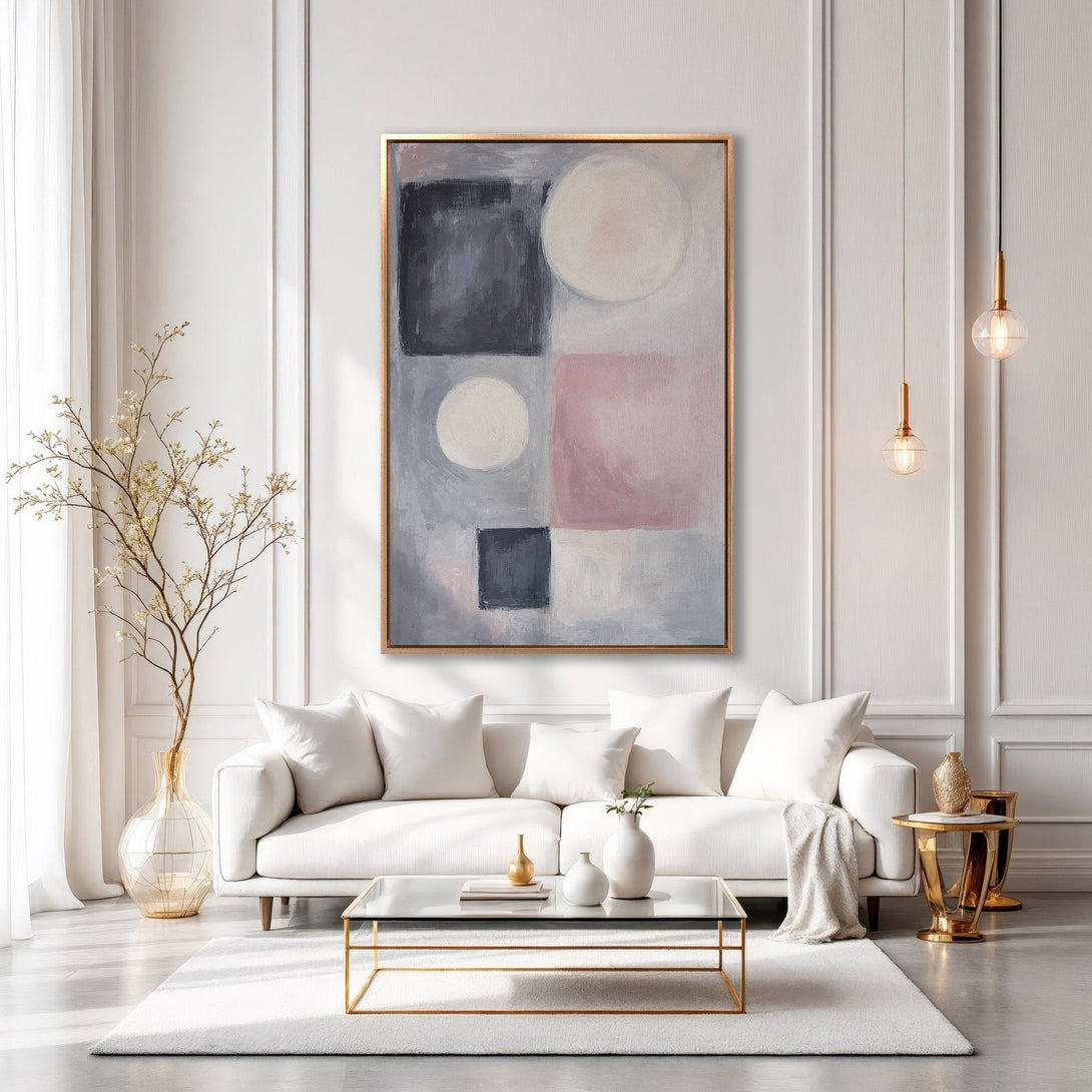 Framed Wall Art: Abstract geometric painting in blush pink, gray, and black. Modern art canvas print adds elegance to a white living room.