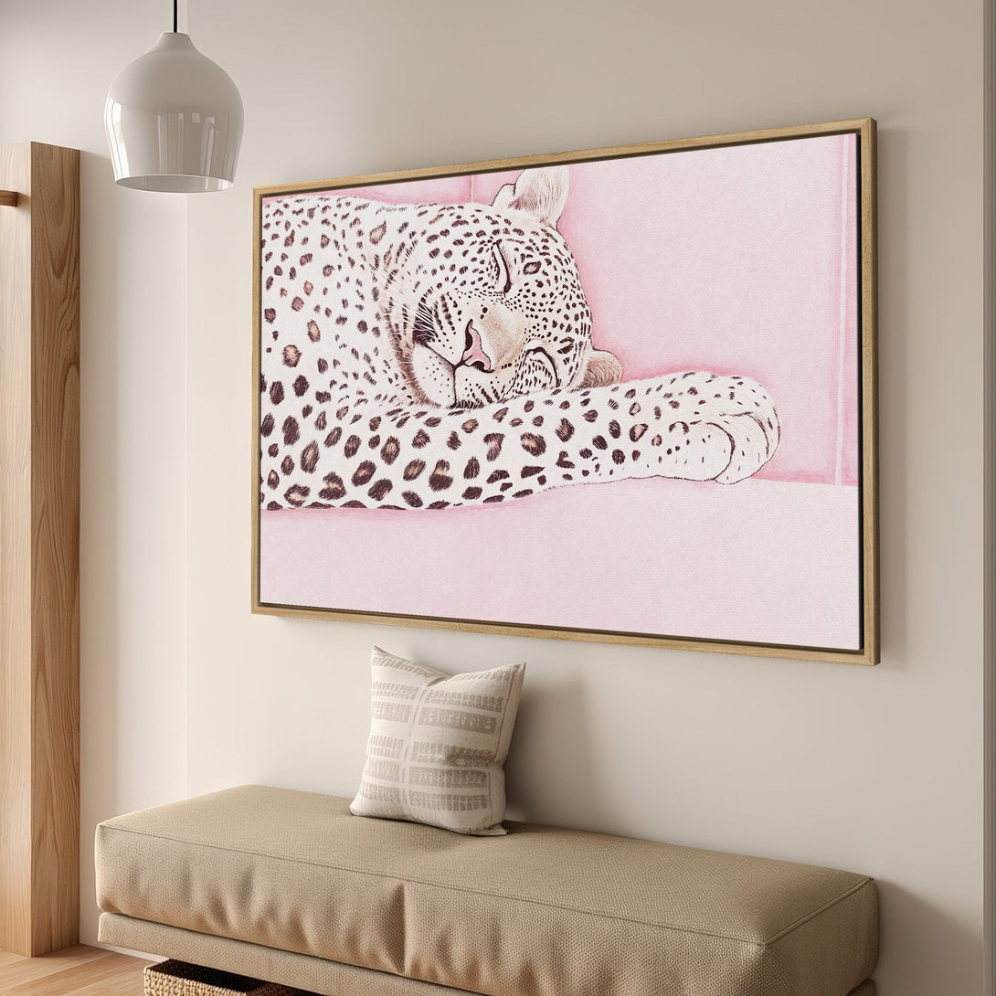 Framed Wall Art featuring a sleeping leopard in soft pink tones. Add a touch of elegance with this stylish canvas print!