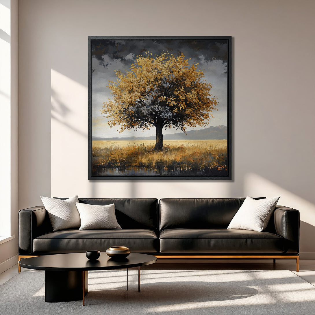 Framed Wall Art of a golden tree in a field, displayed in a modern living room with a neutral color palette. Enhance your space with this beautiful artwork.
