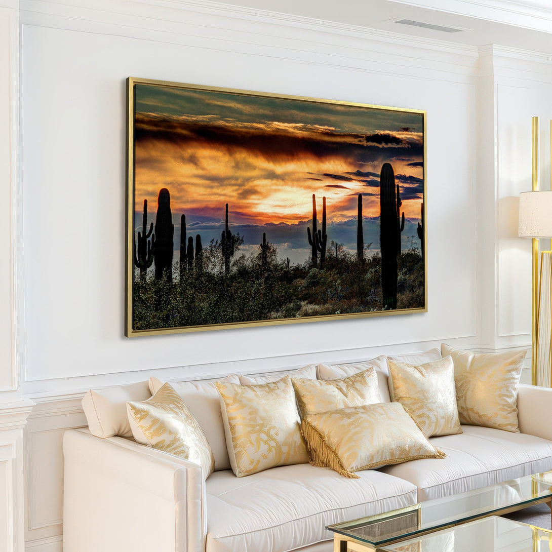 Canvas Print featuring a desert sunset with cacti. Warm orange, yellow, and blue color palette. Adds a touch of nature to any living room.