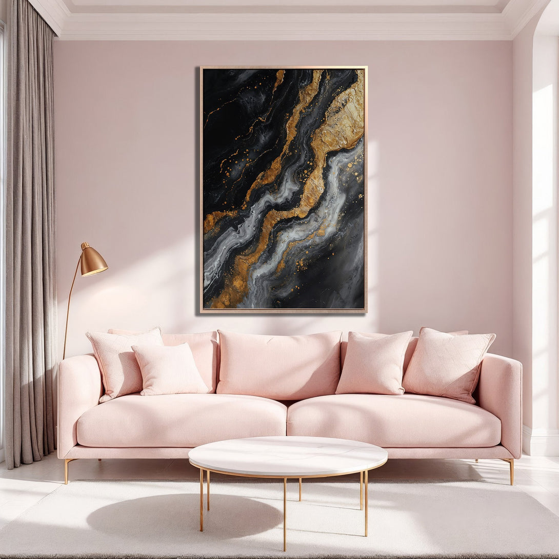 Framed Wall Art: Abstract black, gold, and gray canvas print in a modern living room. Adds a touch of luxury. Shop now for stunning wall decor!