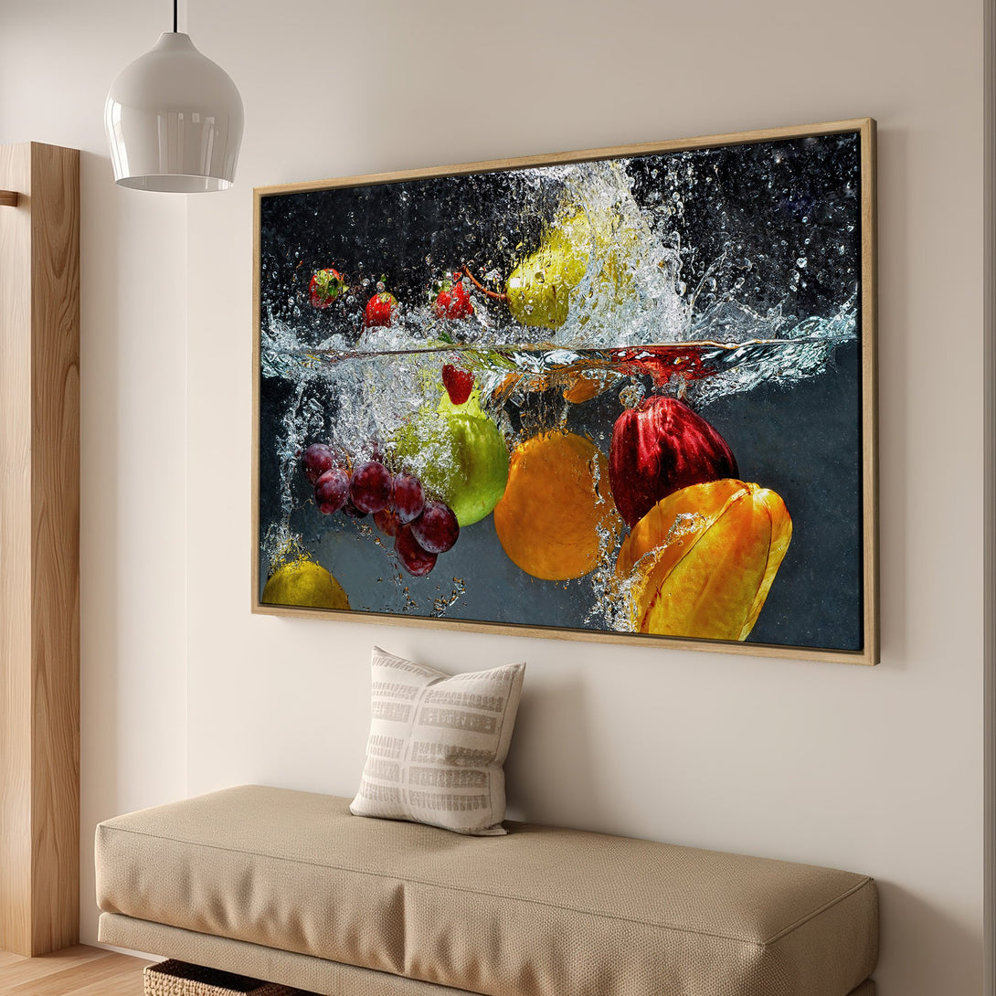 Framed Wall Art featuring vibrant fruit underwater. Modern, colorful canvas print with a dark background and splashes of water. Ideal kitchen decor.