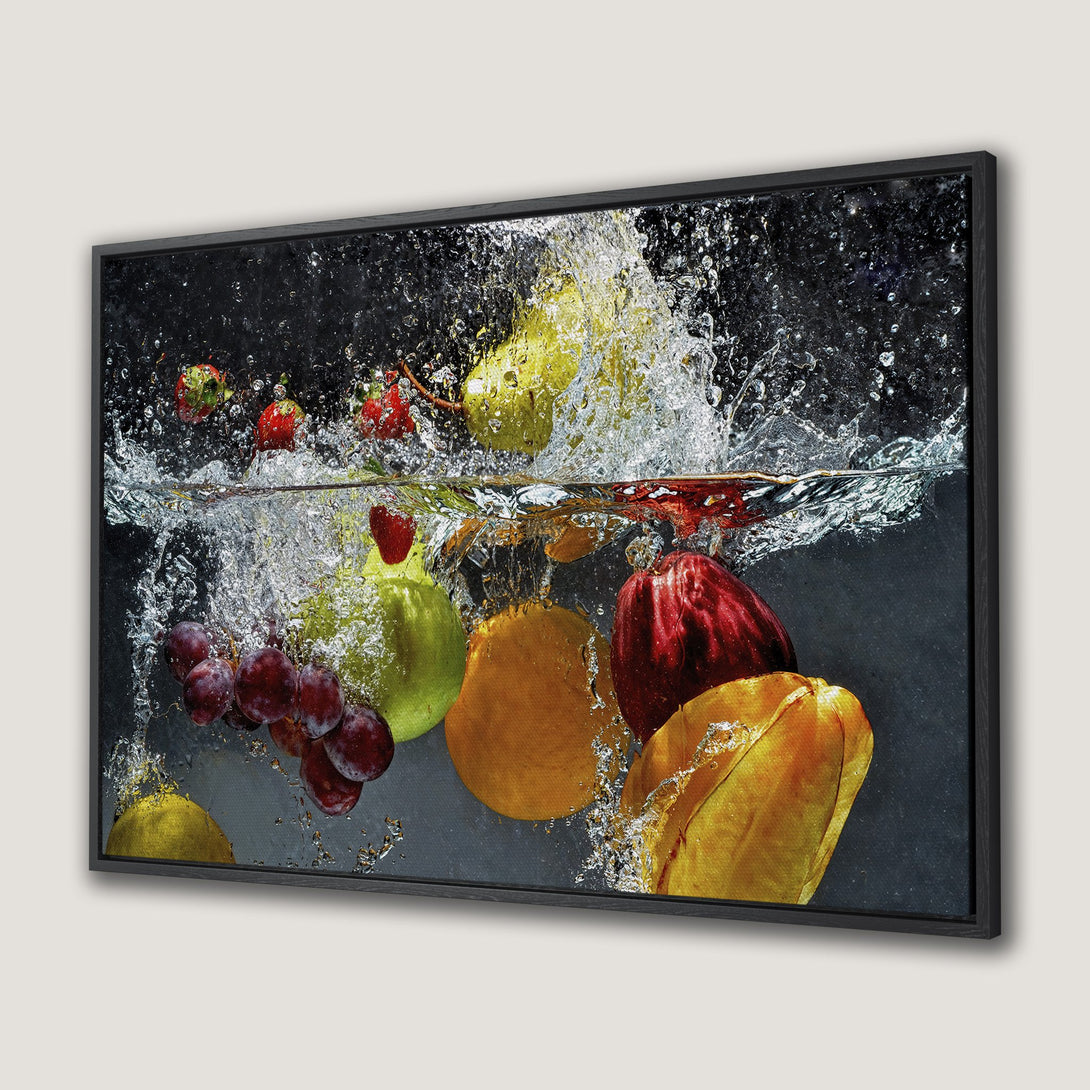 Framed Wall Art: Vibrant fruit splash canvas print. Modern, colorful art with red, yellow, and green hues. Perfect kitchen or dining room decor.