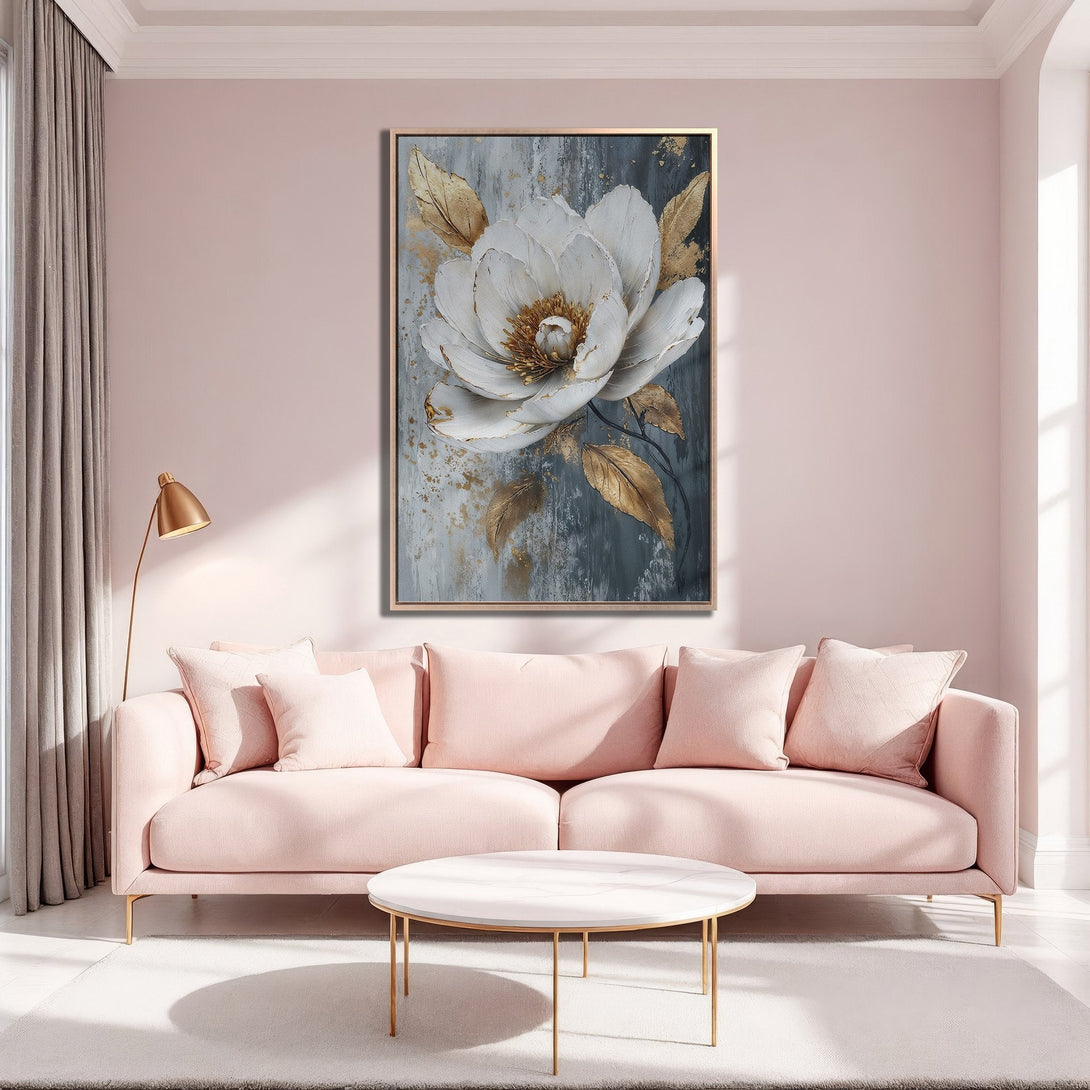 Framed Wall Art featuring a large white flower with gold accents, displayed in a blush pink interior. Modern, stylish canvas print for home decor.