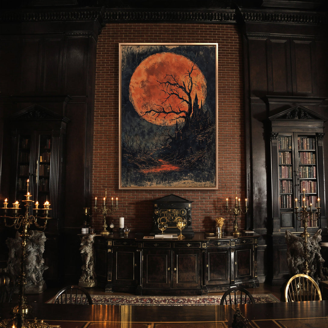 Framed Wall Art featuring a gothic landscape with a blood moon, displayed in a dark, elegant interior. Rich orange, black, and dark wood tones.