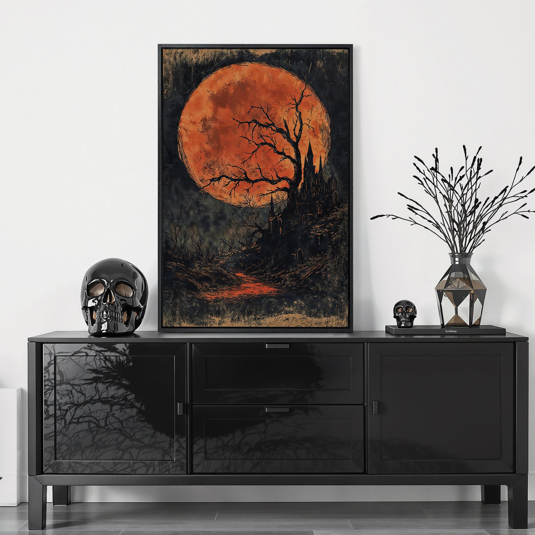 Framed Wall Art: Spooky Halloween scene with a large orange moon, tree, and castle. Dark, moody art in orange and black tones. Perfect for seasonal decor.
