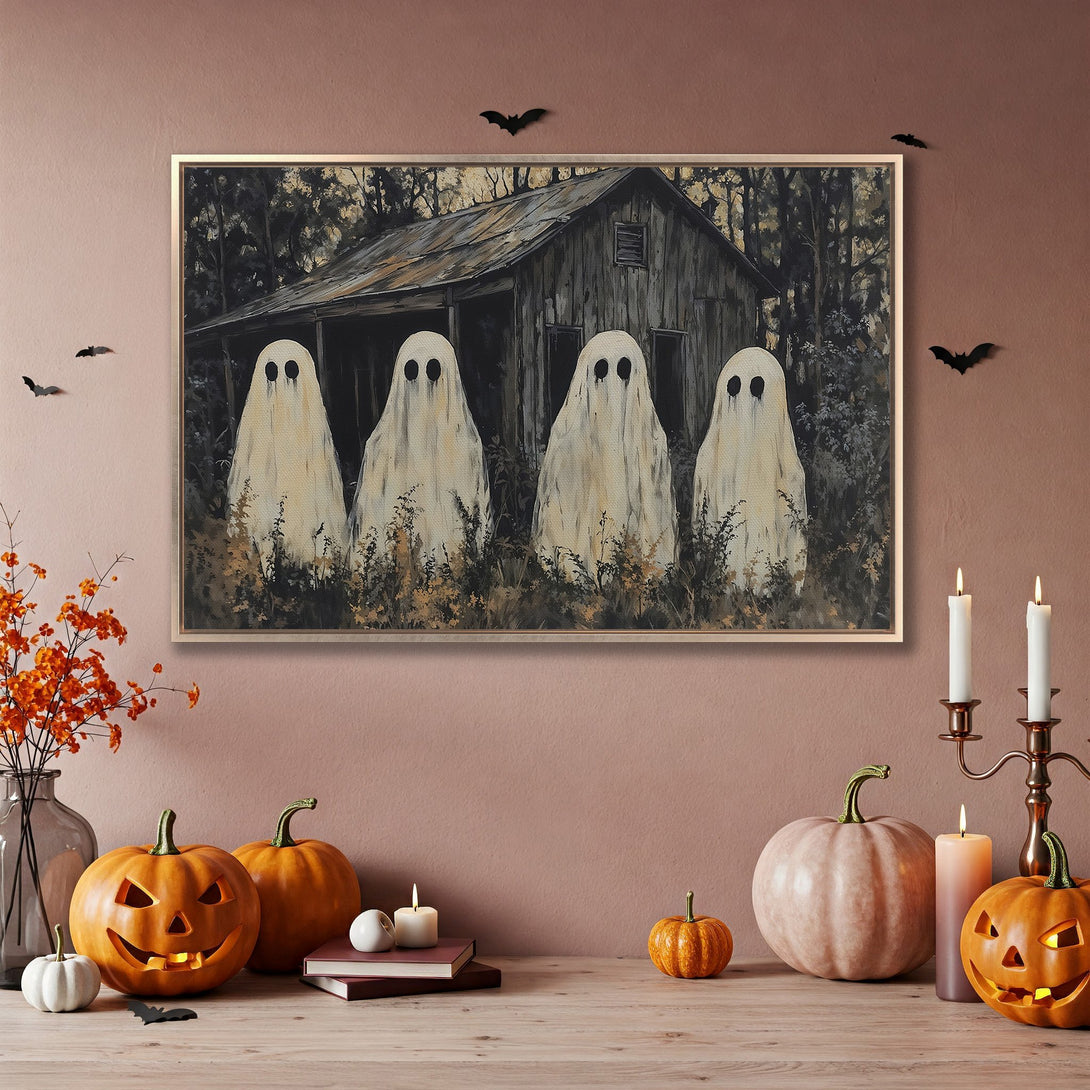 Framed Wall Art: Spooky Halloween ghosts and cabin scene in a muted, earthy color palette. Perfect for adding a touch of eerie charm to your home decor.
