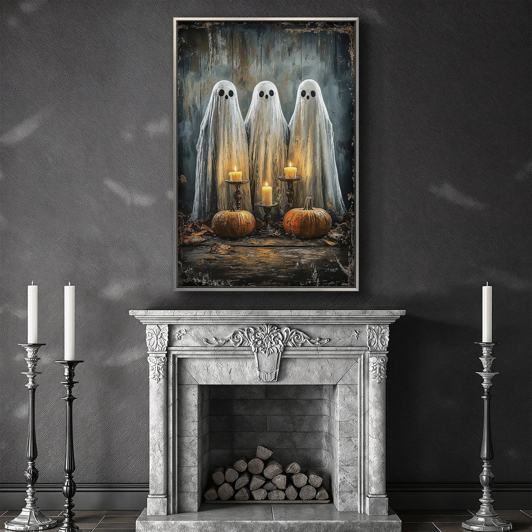 Framed Wall Art: Spooky Halloween canvas print featuring three ghostly figures, pumpkins, and candles. Dark, moody color palette perfect for Halloween decor.